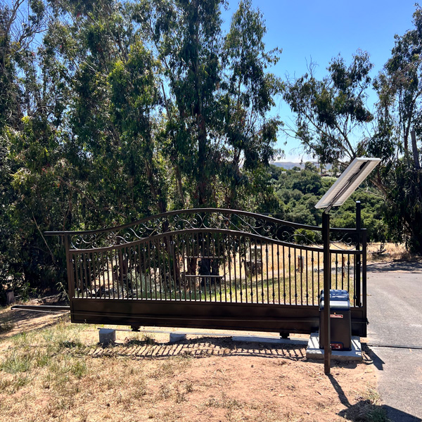 Ornate sliding iron gate installation