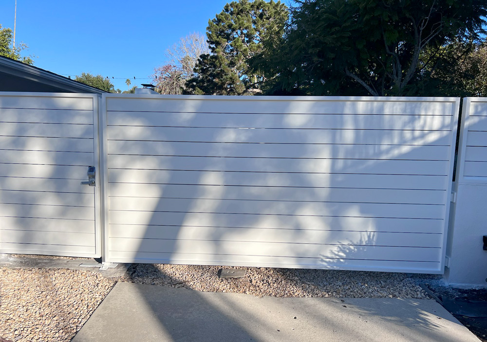 White horizontal driveway and pedestrian gate