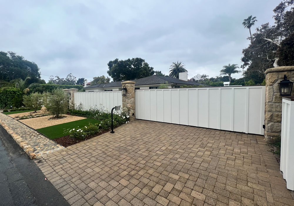 White residential gate with security system